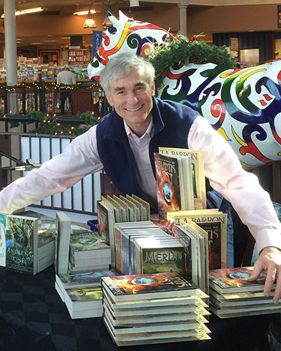 Hugging a big stack of my books before the event at Joseph Beth Booksellers.