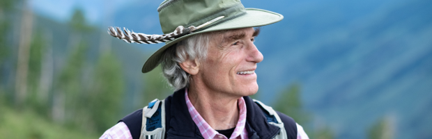 T. A. Barron standing in front of a mountain range in Colorado