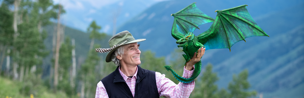 T. A. Barron holding a dragon