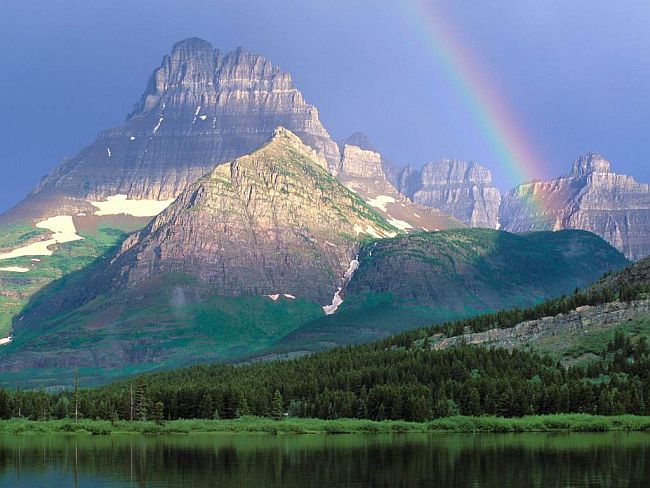 a rainbow over mountains